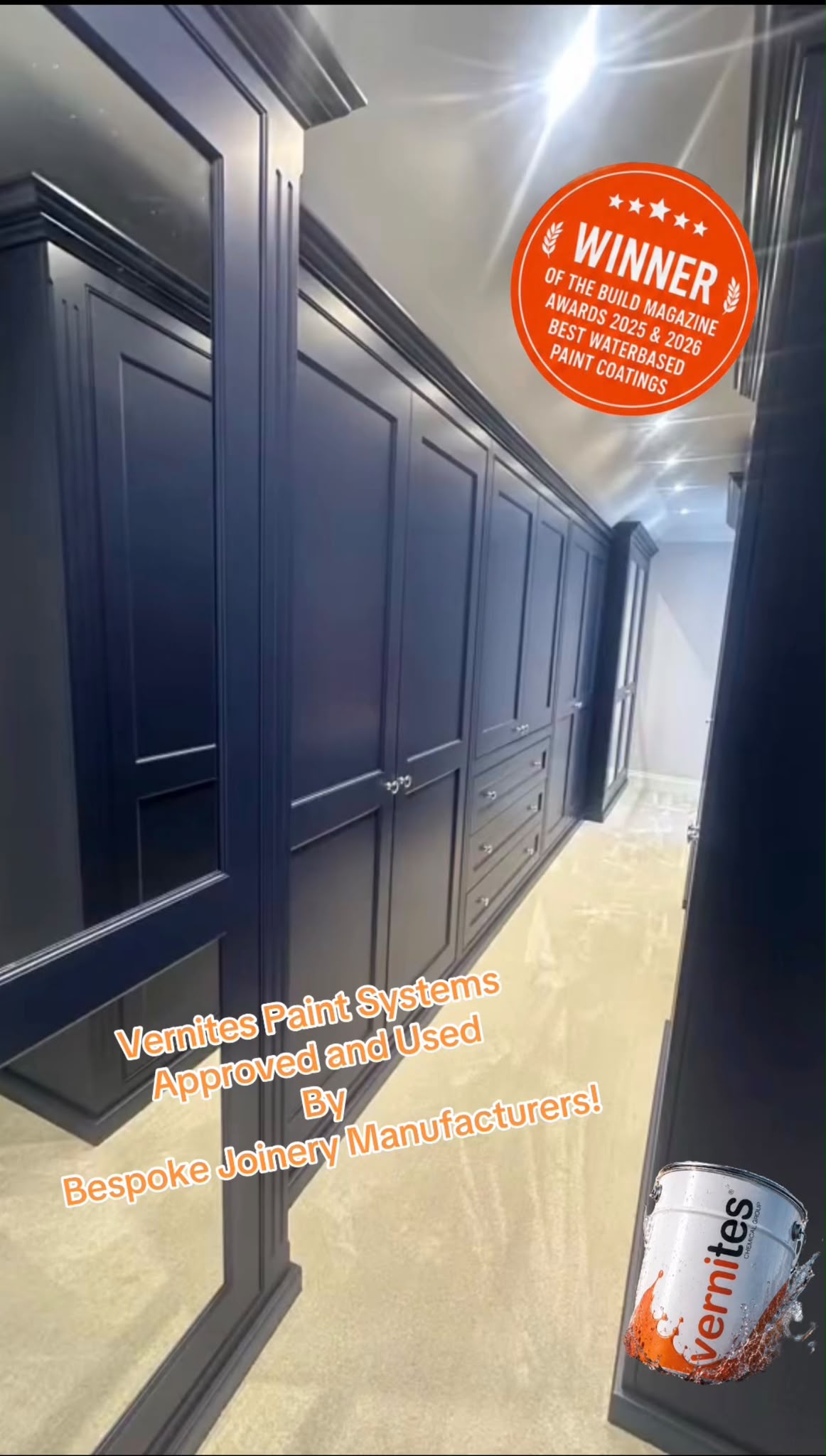 Royal blue fitted wardrobes along a hallway